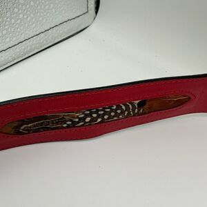 Red Rondina leather belt with feather inlays